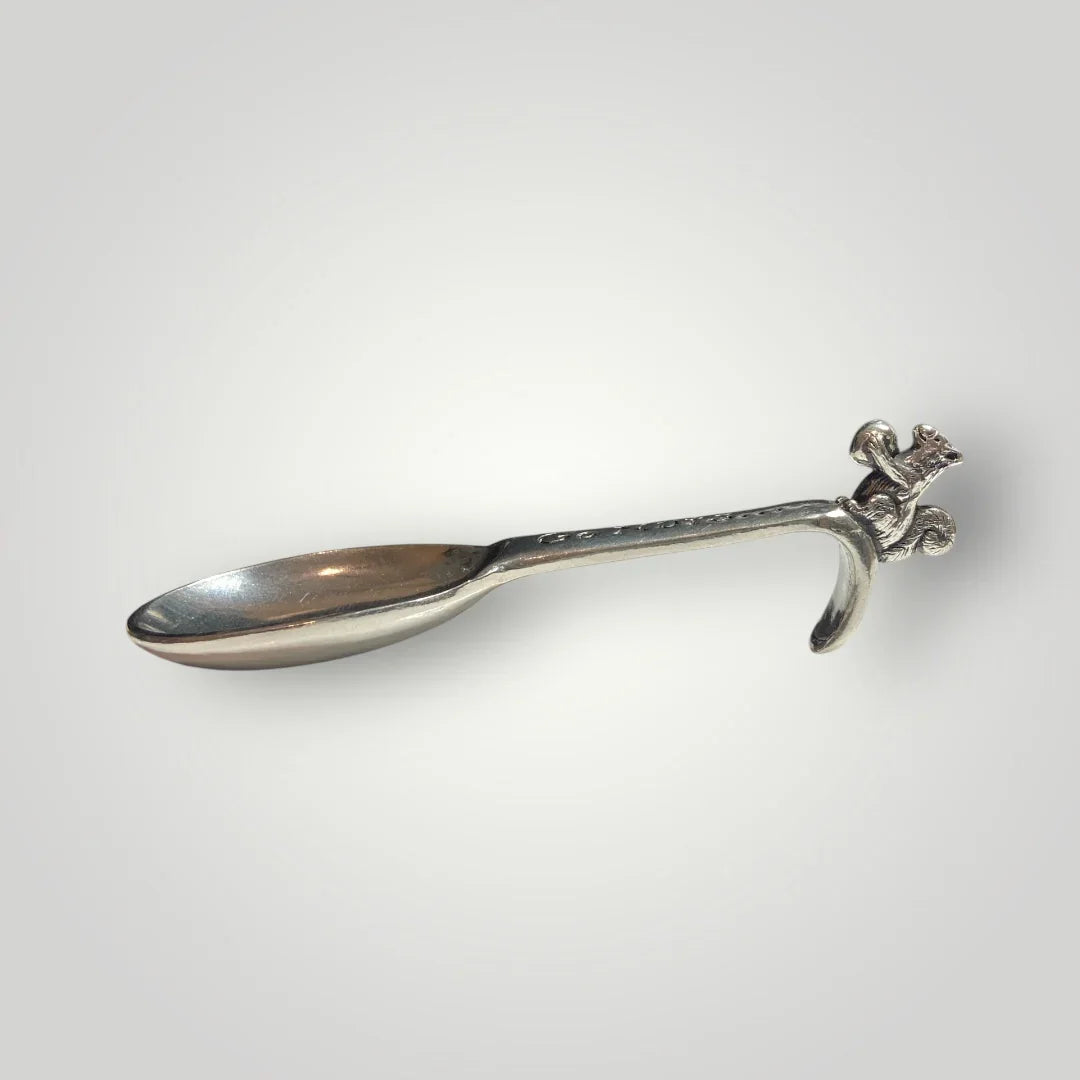 Whimsical pewter nut scoop alternate angle with engraved details