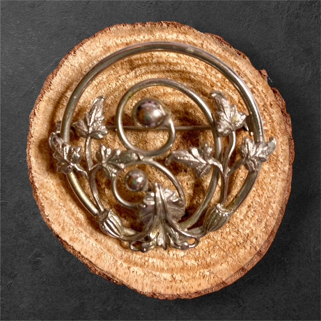 Medallion with Leaves brooch featuring leaf?accented medallion design