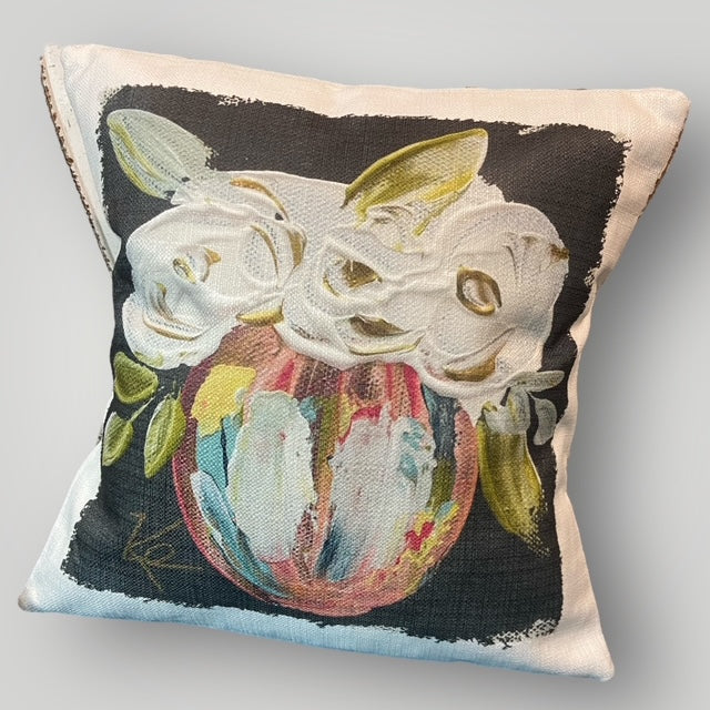 Throw pillow with vibrant rainbow floral design