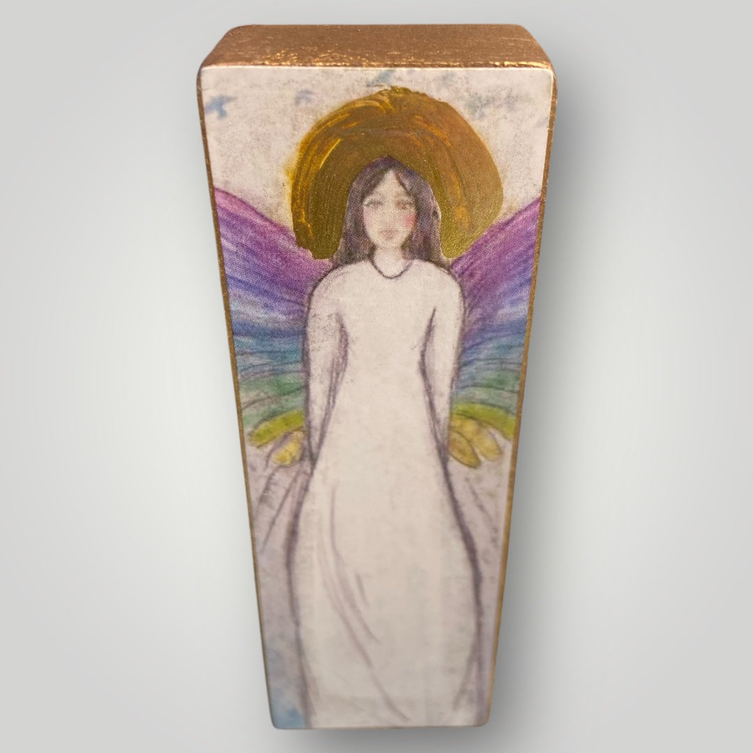 Angel figurine with rainbow wings in vibrant colors