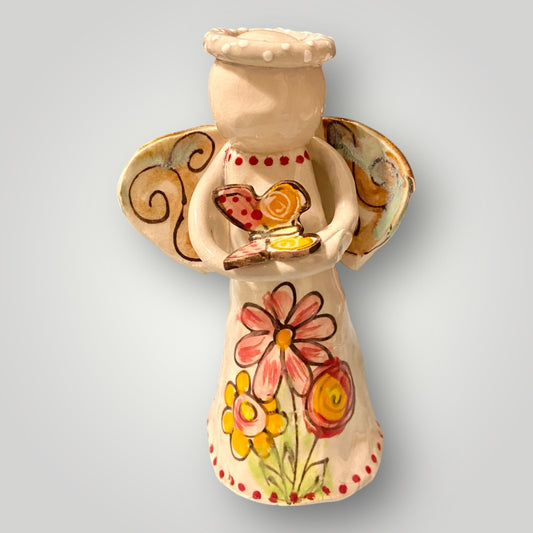 Angel figurine holding butterfly, hand‑sculpted and hand‑painted stoneware by Heartfelt Traditions Pottery