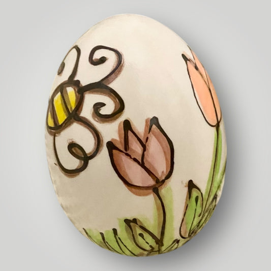 Egg‑shaped pottery piece with hand‑painted bumblebee artwork, handmade by Heartfelt Traditions Pottery