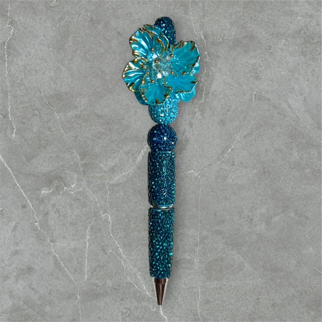Gilded Teal Bloom beaded pen with teal floral beads and gold accents