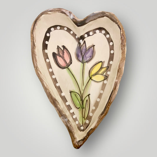 Heart‑shaped pinch bowl with hand‑painted tulips, handmade stoneware by Heartfelt Traditions Pottery