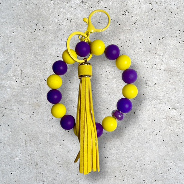 Purple and Gold beaded wristlet keychain with yellow tassel