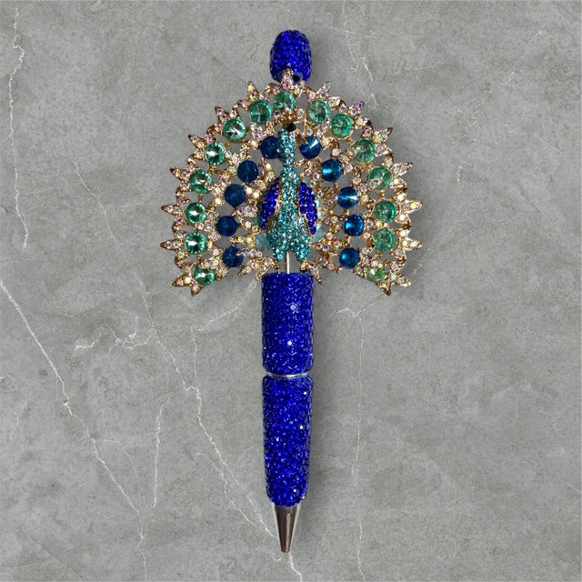 The Manor Peacock beaded pen with peacock charm and jewel?tone beads