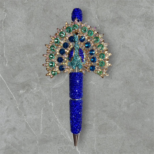 The Manor Peacock beaded pen with peacock charm and jewel?tone beads