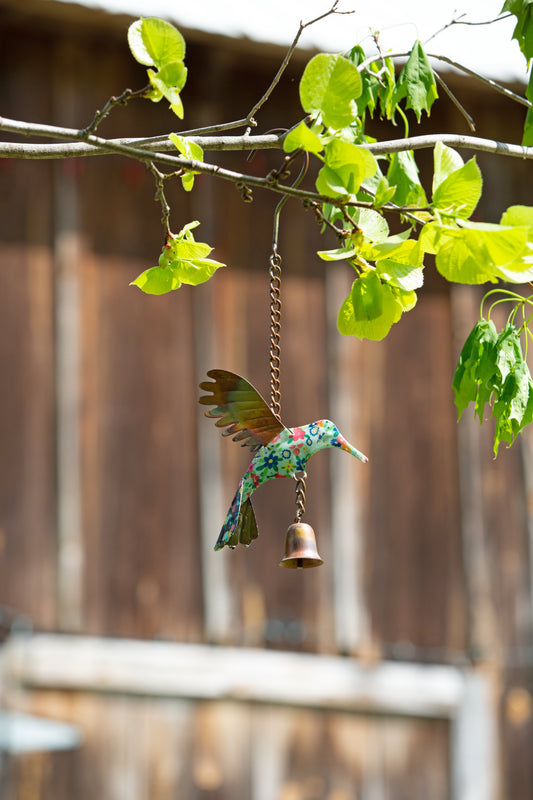 Handcrafted hummingbird garden ornament with vibrant colors and whimsical outdoor design